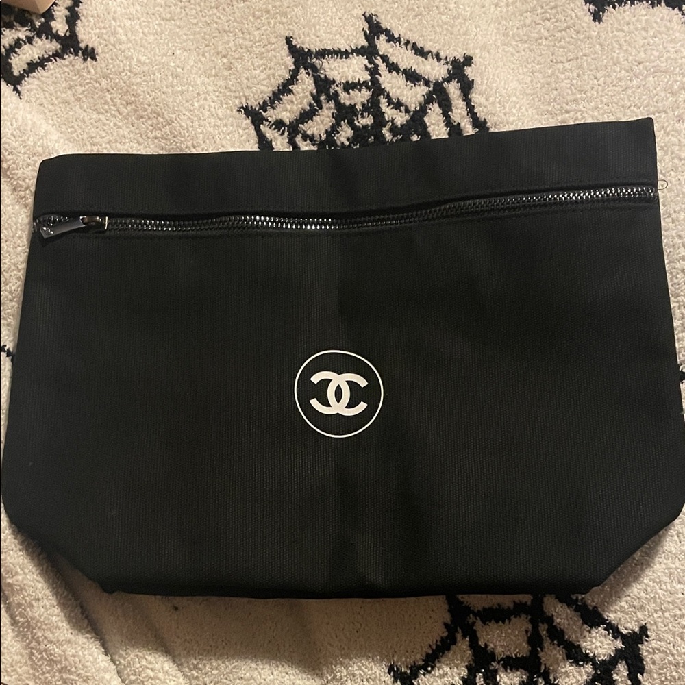 CHANEL Black Zippered Bag with Iconic Emblem